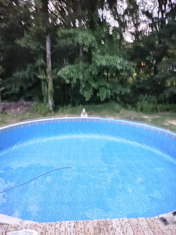 Above-ground pool with a fresh blue liner